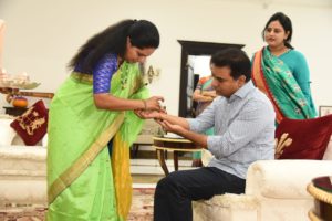 TRS MP Kavitha Tying Rakhi to Minister KT Rama Rao (1)