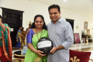 TRS MP Kavitha Tying Rakhi to Minister KT Rama Rao