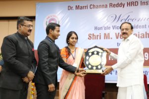 M. Venkaiah Naidu, Hon'ble Vice President giving away rolling shield for best presentation on Trek. Sri B.P. Acharya, IAS, DG of the Institute is also seen in the picutre.