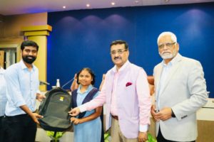 2.Sri BP Acharya, IAS. Spl Chief Secretary & DG of Institute and a trainee Civil Servant presenting kit to a girl child from Telangana State Residential School as a part of Nurture the Future Initiative